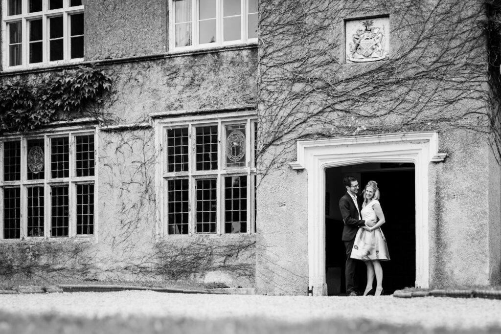 a couple in the doorway of old forde house registry office newton abbot