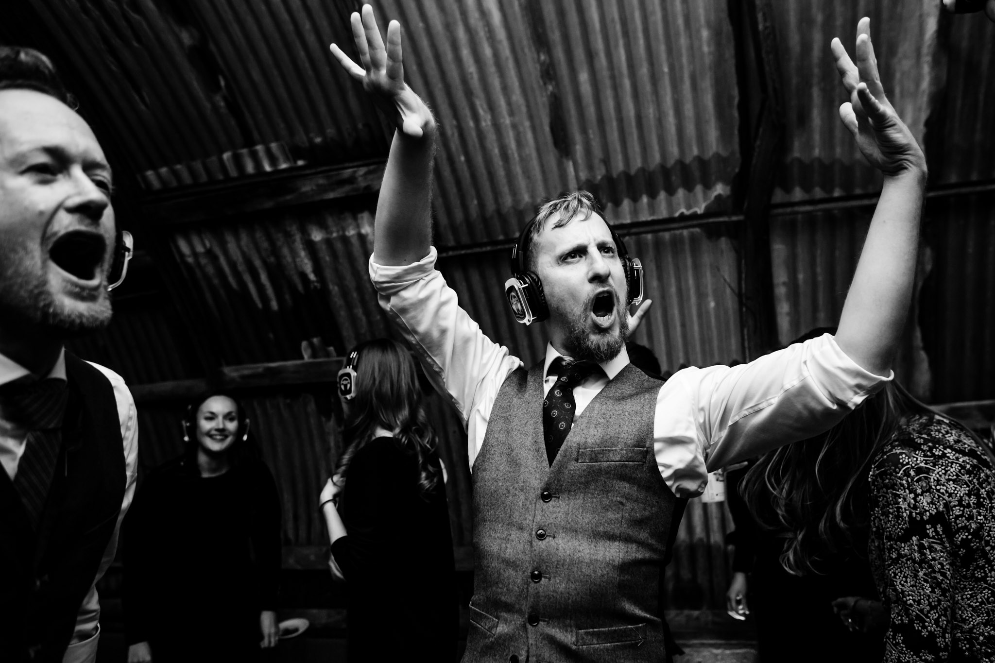 wedding guest pulling a crazy dance move to the silent disco in the nissen hut at anran devon