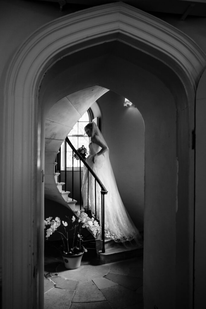 bride walking up stairs to ceremony belvedere castle exeter devon