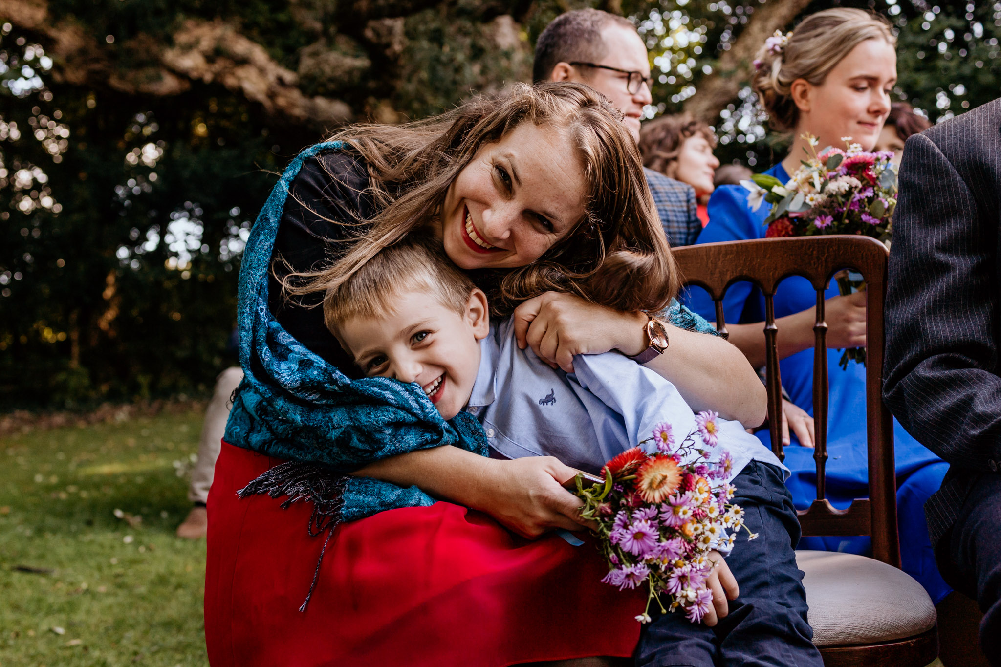 wedding guest family member hugs her little boy colehayes wedding