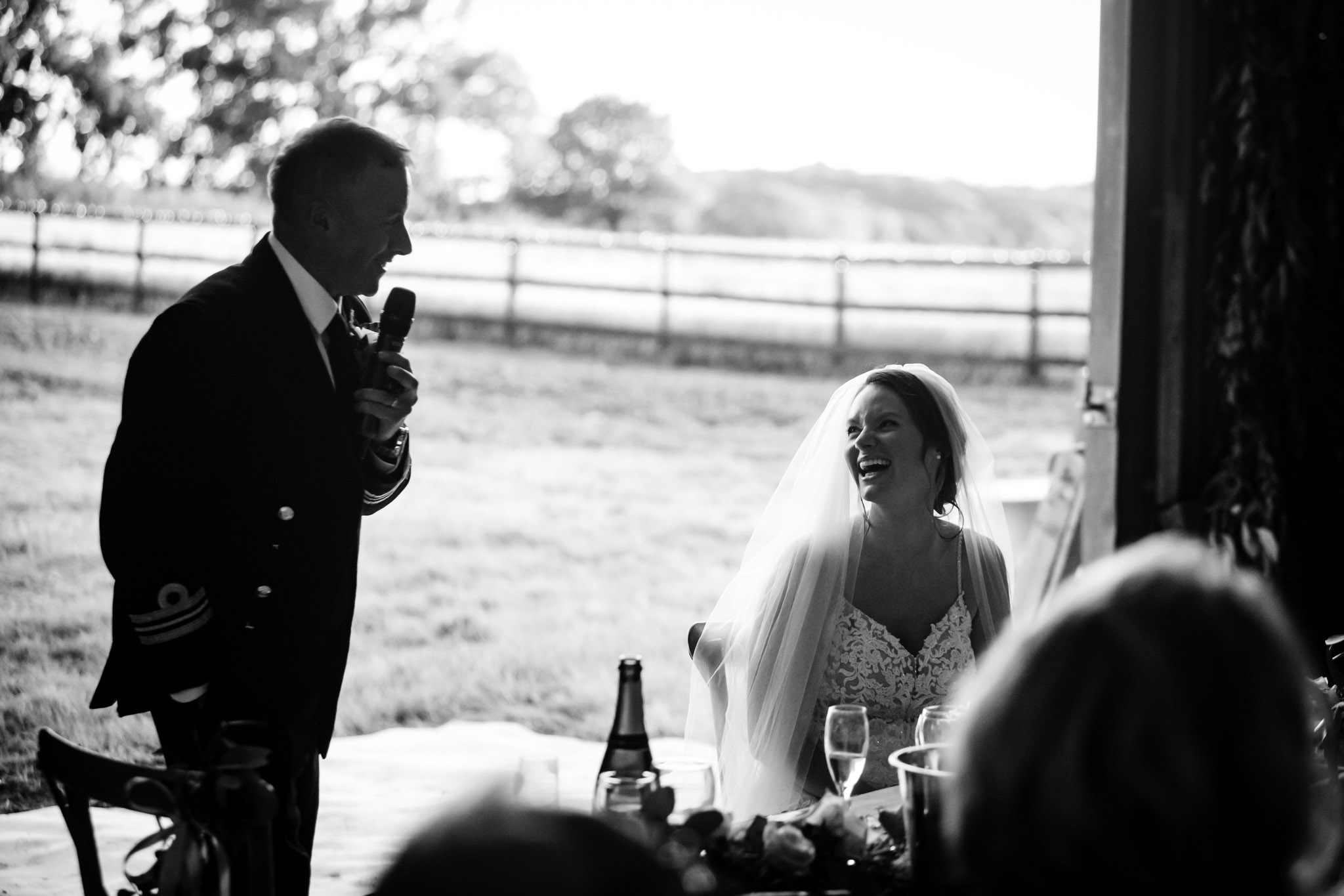 grooms give a speech to his bride at a barn wedding near crediton devon