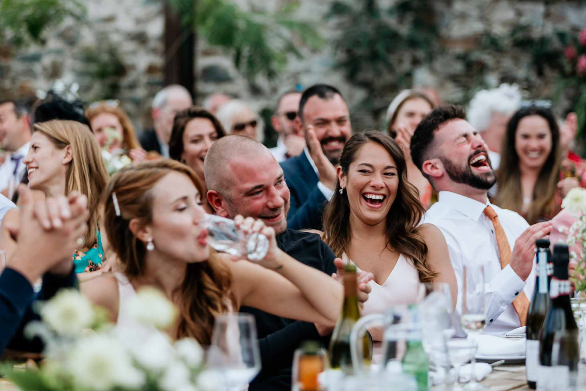 guests enjoying the speeches at a fun wedding at anran tidwell farm devon