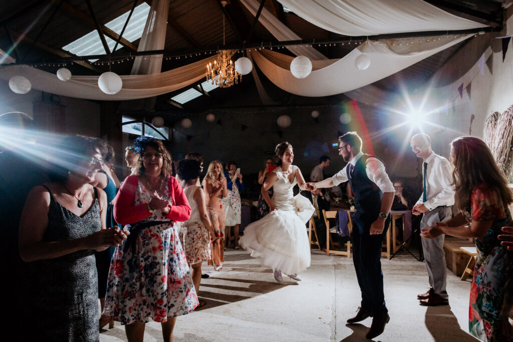 couple dancing in the barn at barons hill avonwick