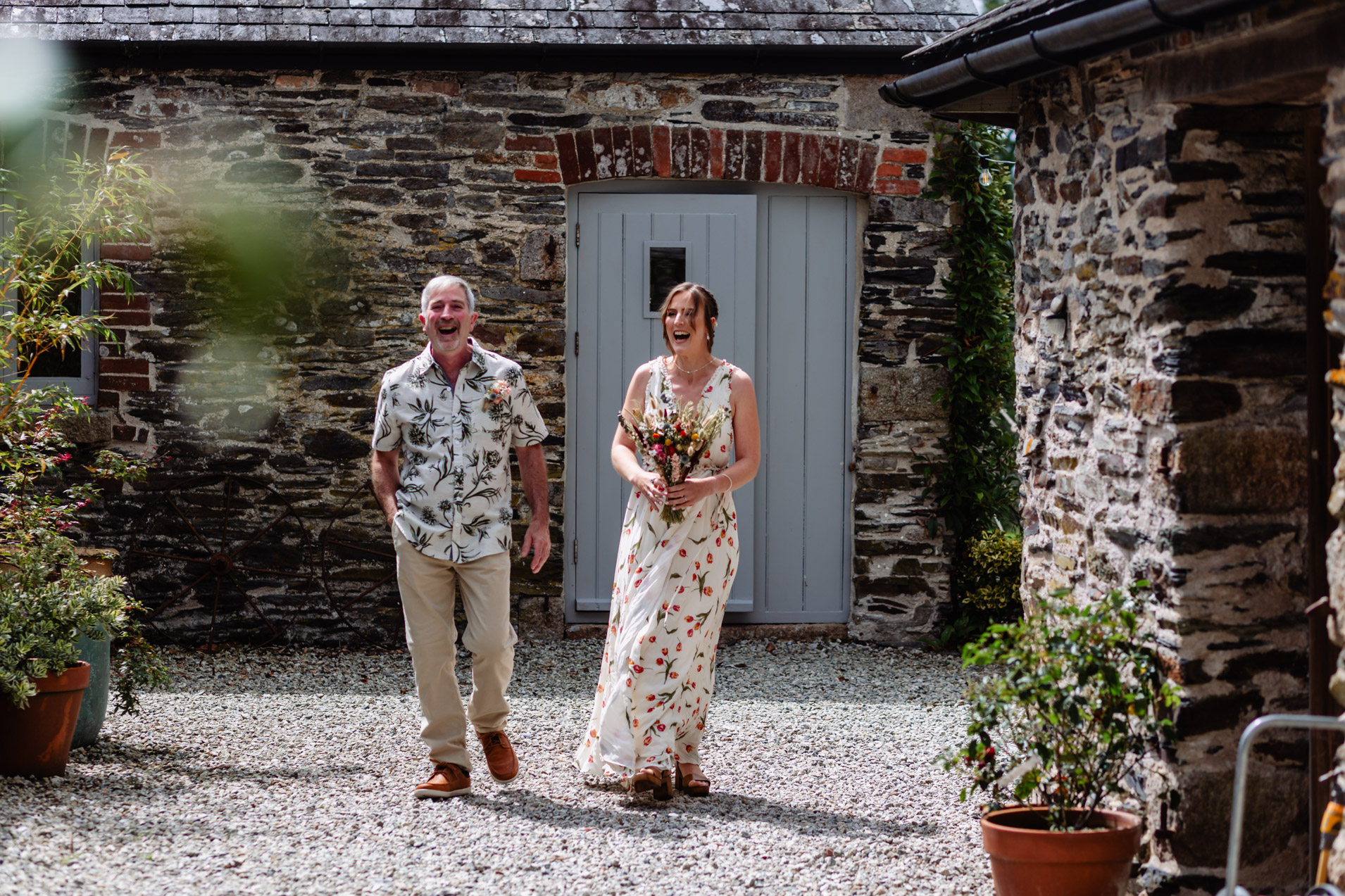 bride and her dad having a funny moment before the ceremony at wonwood barton devon