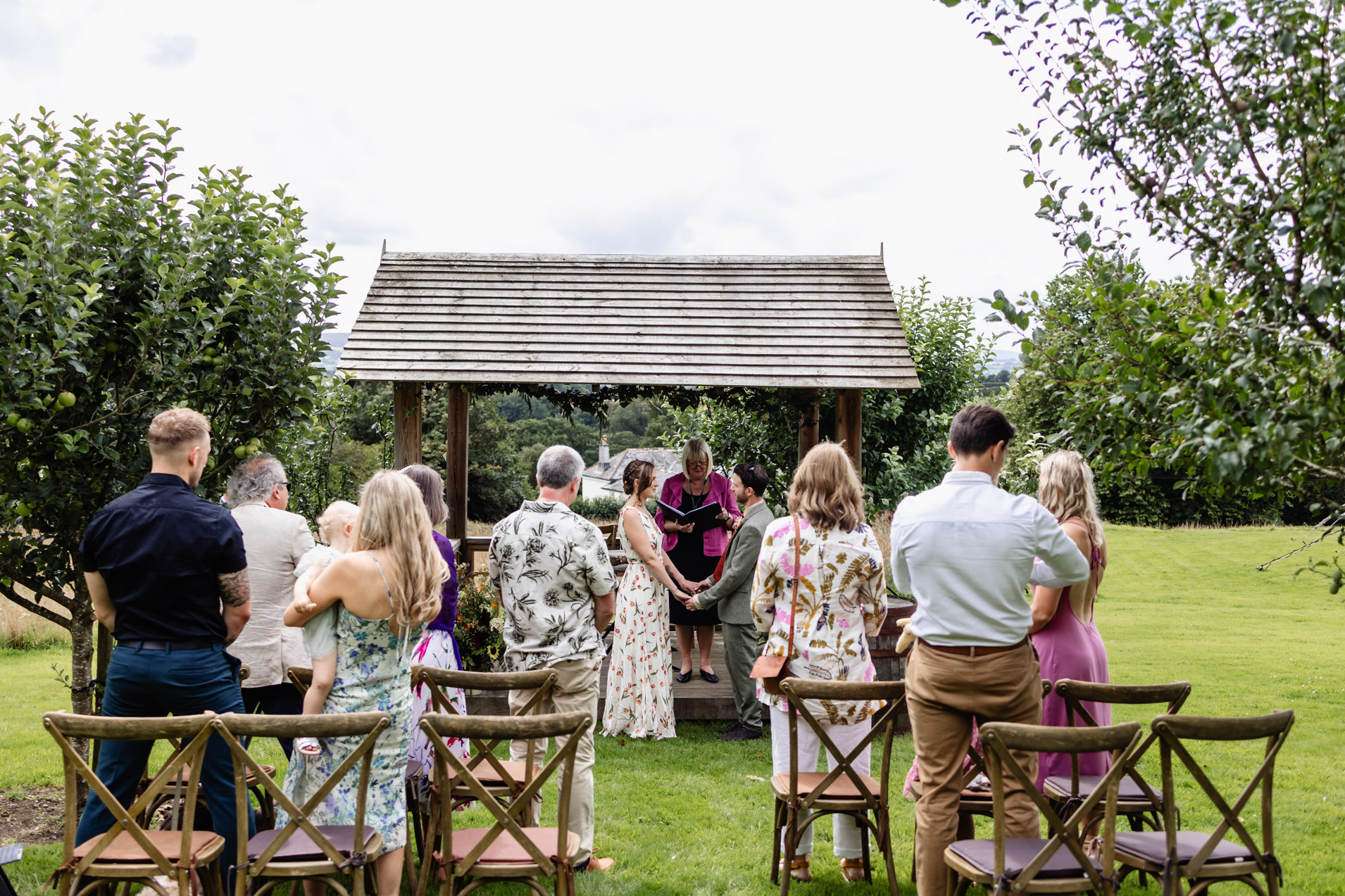 wedding ceremony in the orchard at wonwood barton near tavistock devon