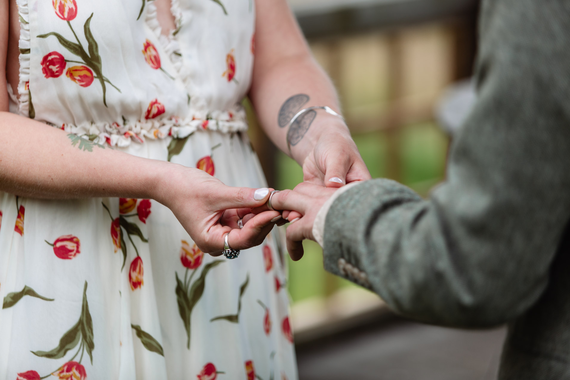 bride puts wedding ring on grooms finger at wonwood barton devon