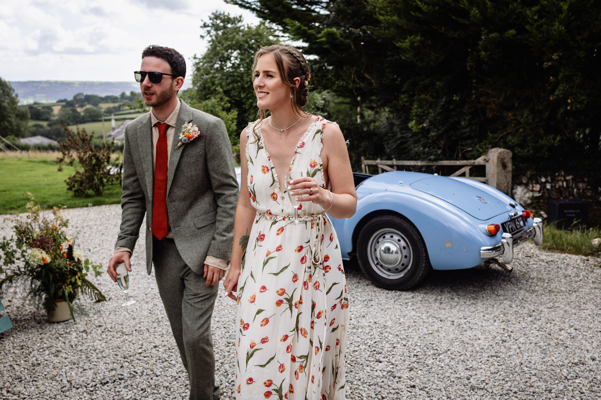 bride and groom join their guests in the courtyard at wonwood barton wedding