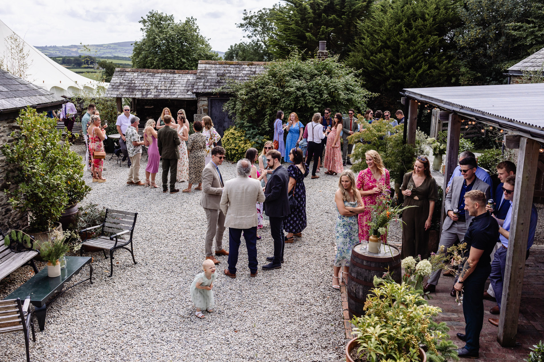 the courtyard and guests at wonwood barton devon wedding venue