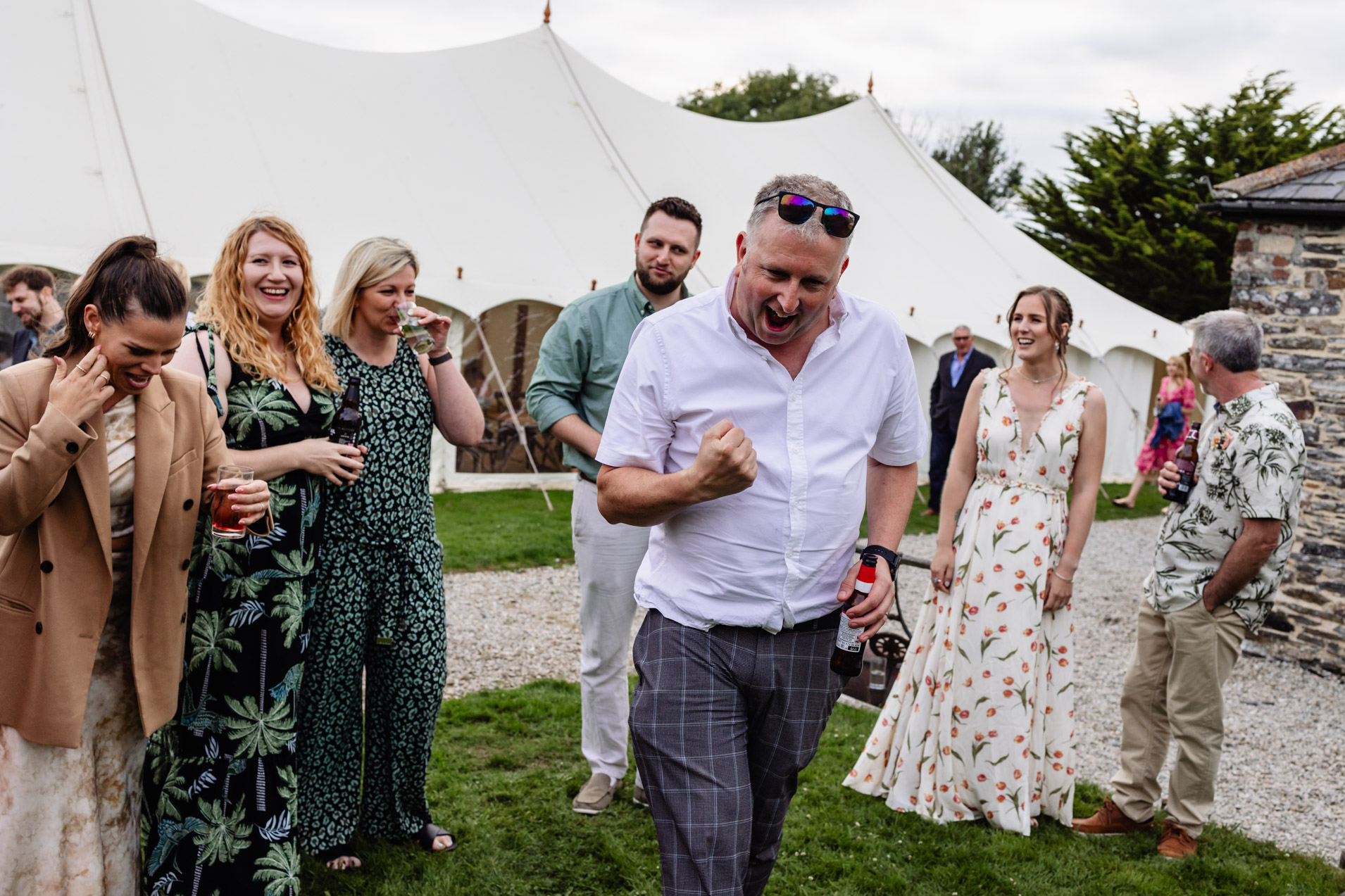guests having fun with lawn games at wonwood barton wedding