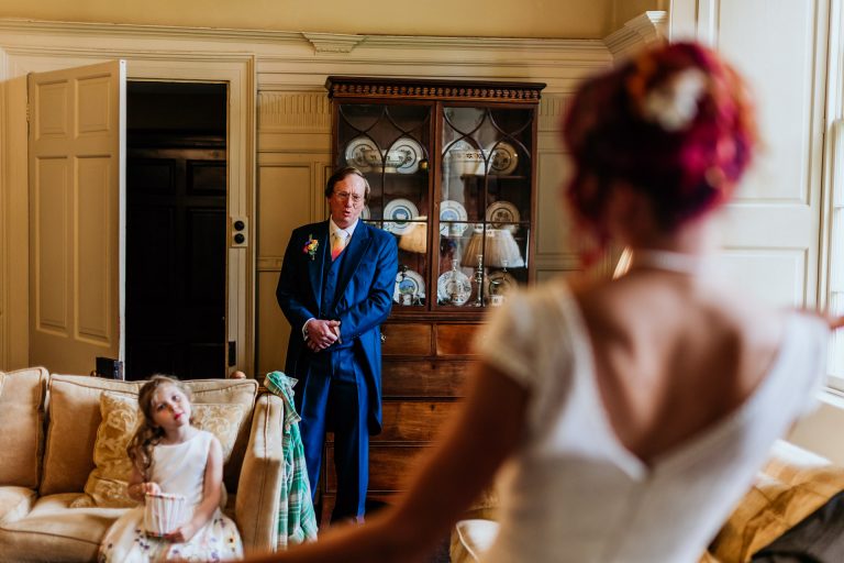 brides dad gets emotional when he sees his daughter in her wedding dress