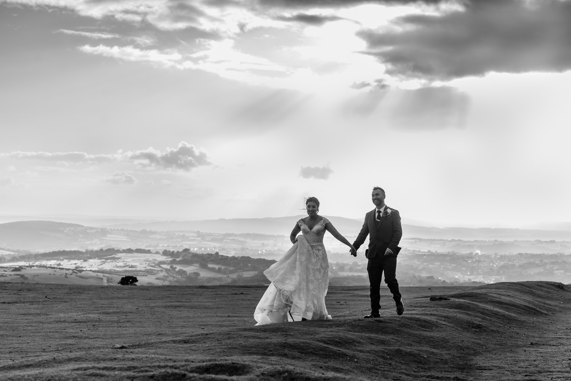 the sun breaks out of the clouds on dartmoor, this brides favourite place