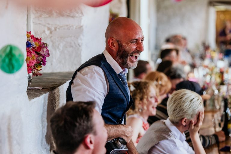 guest laughs at speeches at bradstone manor wedding