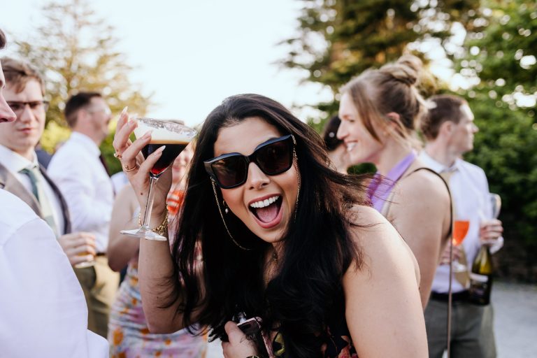 a happy guest with an espresso martini