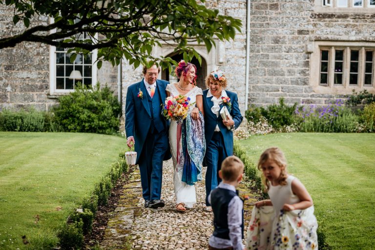 bride with mum and dad in matching outfits at bradstone manor