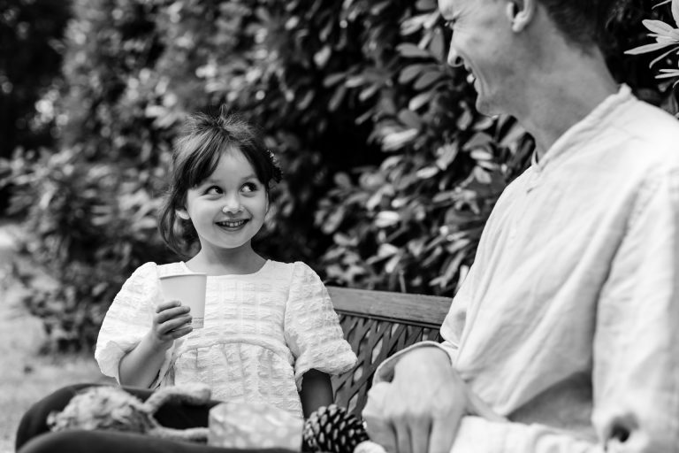 cute kid looks at her dad wide eyed at ashridge great barn