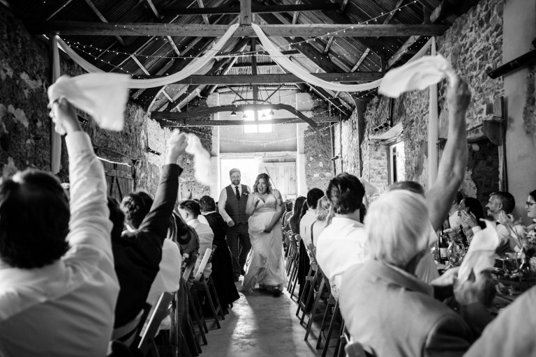 ashridge great barn makes a lovely rustic venue for the entrance of the bride and groom