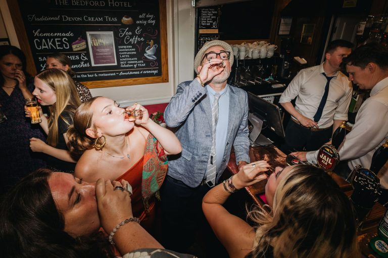 guests down some shots at a bedford hotel wedding in tavistock