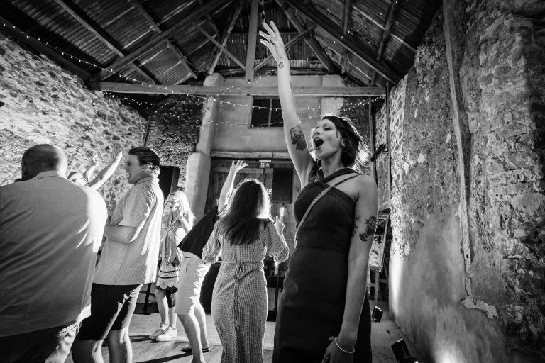 bridesmaid showing total joy on the dancefloor at ashridge great barn