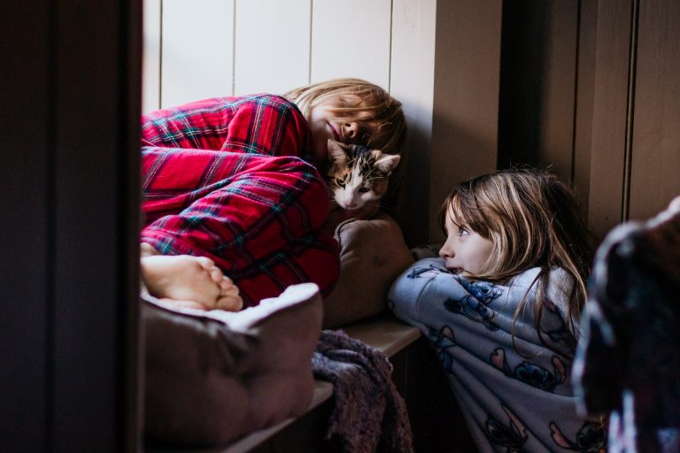 kids hug their cat during a day in the life photo session