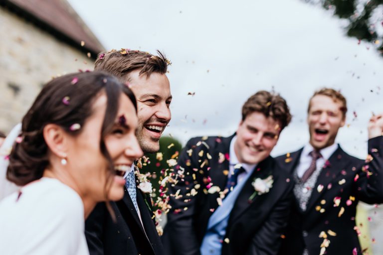confetti side close up of the bride and groom, devon farm wedding in filleigh
