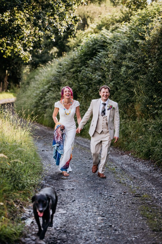 walking the dog down to the oak tree at their wedding