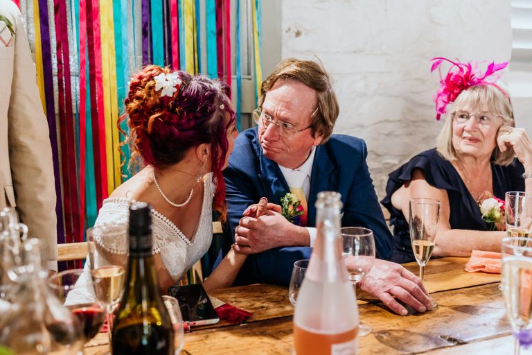 a father of the bride gets emotional with his daughter after his speech