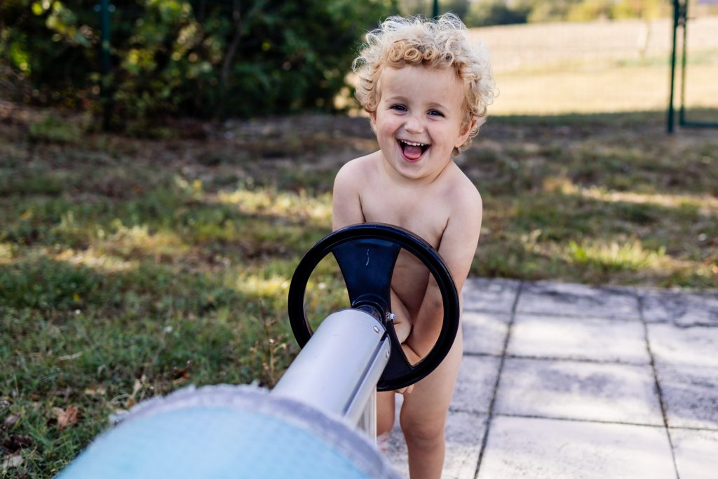 toddler by the swimming pool in france